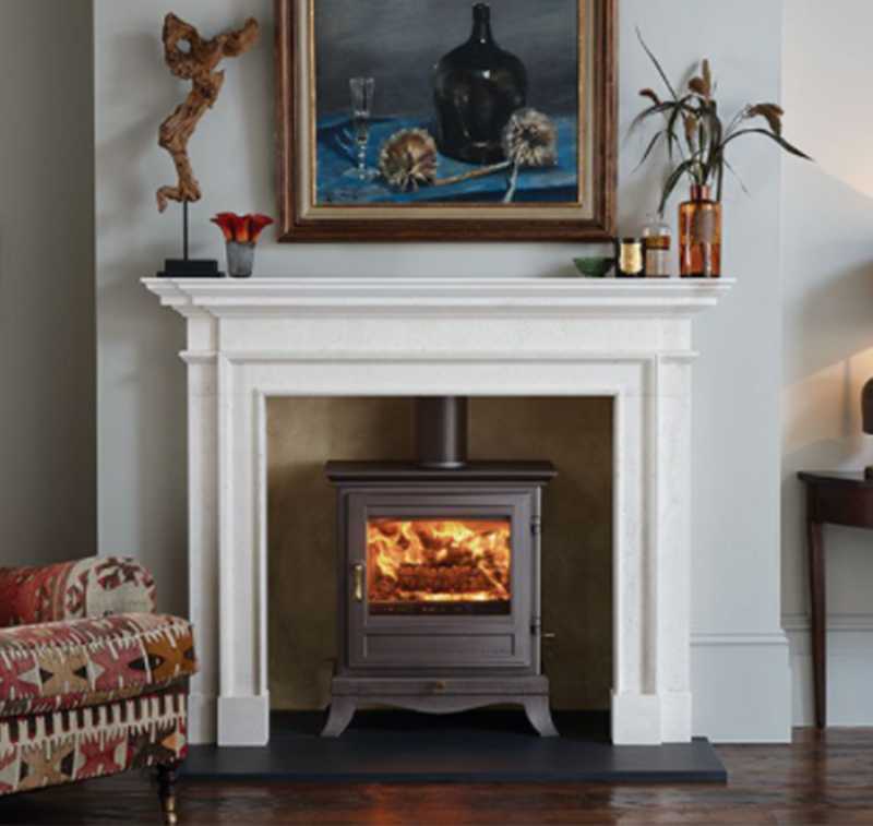 chesneys woodburning stove with white surround
